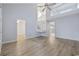 Spacious and bright living room with vaulted ceiling, second-story loft, and stylish laminate flooring at 650 Wilshire Ln., Murrells Inlet, SC 29576