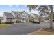 Charming townhomes with colorful shutters and landscaping, offering a welcoming and vibrant neighborhood atmosphere at 650 Wilshire Ln., Murrells Inlet, SC 29576