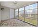 Enclosed sunroom features tiled flooring and large windows offering views of the backyard at 650 Wilshire Ln., Murrells Inlet, SC 29576