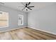 Bedroom featuring luxury vinyl floors, a ceiling fan, and natural light at 6606 Wildwood Trail # E, Myrtle Beach, SC 29572