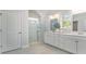 Bright bathroom featuring double sinks, a glass-enclosed shower, and elegant fixtures at 7006 Shooting Star Way, Myrtle Beach, SC 29579