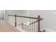 A modern staircase with white spindles and a stained wood railing, leading to the upper level at 7006 Shooting Star Way, Myrtle Beach, SC 29579