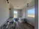Bright bathroom features a soaking tub beneath a window, a granite countertop, and modern lighting at 713 Horry Rd., Conway, SC 29526