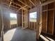 A framed bedroom featuring natural light streaming through the two windows at 713 Horry Rd., Conway, SC 29526