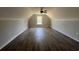 Spacious bonus room with wood floors and a large window offering plenty of natural light at 713 Horry Rd., Conway, SC 29526