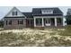 New construction brick home with a covered porch and white columns at 713 Horry Rd., Conway, SC 29526