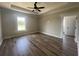 Bright and spacious bedroom with tray ceilings and wood-look floors at 713 Horry Rd., Conway, SC 29526