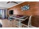 Charming dining area with wood-paneled wall and a rustic dining table at 7509 N Ocean Blvd. # 1203, Myrtle Beach, SC 29572