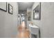 Bright condo hallway with beach access, wood flooring, and textured walls provides a stylish entrance at 7509 N Ocean Blvd. # 1203, Myrtle Beach, SC 29572
