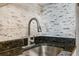 Stainless steel sink with a modern faucet and granite counter at 7509 N Ocean Blvd. # 1203, Myrtle Beach, SC 29572