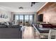 Spacious living room flows into dining area, leading to a scenic balcony at 7509 N Ocean Blvd. # 1203, Myrtle Beach, SC 29572