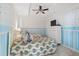 Charming bedroom featuring two twin beds, a ceiling fan, and a white dresser with television at 8500 Margate Circle # 1807, Myrtle Beach, SC 29572