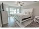 Cozy main bedroom featuring a bay window, a neutral color palette, and a large bed at 901 Tullamore Ct., Myrtle Beach, SC 29579