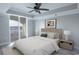 A well-lit bedroom featuring vinyl floors, tray ceilings and access to a private balcony at 9547 Edgerton Dr. # 204, Myrtle Beach, SC 29572