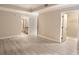 Open Primary bedroom and bath with grey wood floors and a walk-in closet at 9547 Edgerton Dr. # 204, Myrtle Beach, SC 29572