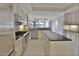 Spacious kitchen boasts stainless steel appliances, granite countertops, and an island at 9547 Edgerton Dr. # 204, Myrtle Beach, SC 29572
