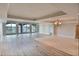 Spacious living room featuring two types of flooring and a wall of windows at 9547 Edgerton Dr. # 204, Myrtle Beach, SC 29572
