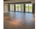 Living room featuring flooring, a wall of windows, and an outdoor view at 9547 Edgerton Dr. # 204, Myrtle Beach, SC 29572
