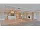 Open floor plan with a fireplace, wet bar, and view into the kitchen at 9547 Edgerton Dr. # 204, Myrtle Beach, SC 29572