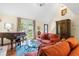 Comfortable living area with a piano, decorative armoire, glass table, and french doors to a patio at 966 Waterway Ln., Myrtle Beach, SC 29572