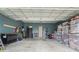 Spacious garage with exposed ceiling beams, teal walls and ample storage space for vehicles and belongings at 101 Galil Dr. # A, Myrtle Beach, SC 29579