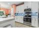 Well-equipped kitchen with stainless steel appliances and stylish blue backsplash at 101 Galil Dr. # A, Myrtle Beach, SC 29579