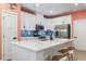 A modern kitchen with stainless steel appliances, white cabinets, and a stylish blue backsplash at 101 Galil Dr. # A, Myrtle Beach, SC 29579