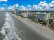 Aerial view showcasing a beachfront hotel and the adjacent shoreline at 1105 South Ocean Blvd. # 852, Myrtle Beach, SC 29577