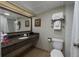 Clean bathroom featuring granite countertop, sink, toilet, and ample towel storage at 1105 South Ocean Blvd. # 852, Myrtle Beach, SC 29577