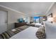 Comfortable bedroom with two queen beds, dresser with TV, and scenic views from the private balcony at 1105 South Ocean Blvd. # 852, Myrtle Beach, SC 29577