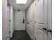 Hallway with neutral paint, a door with a 'Do Not Disturb' sign, and carpeted flooring at 1105 South Ocean Blvd. # 852, Myrtle Beach, SC 29577
