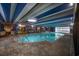 Bright indoor pool with blue accents and decorative murals in a vacation resort at 1105 South Ocean Blvd. # 852, Myrtle Beach, SC 29577