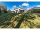 Expansive backyard view from a raised perspective, showcasing the home's screened porch at 1182 Palm Crossing Dr., Little River, SC 29566