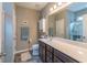 Bathroom featuring a dark wood vanity with modern sink and fixtures, large mirror, and a separate shower with glass door at 1182 Palm Crossing Dr., Little River, SC 29566