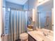 Full bathroom with a shower-tub combo and a vanity with storage at 1182 Palm Crossing Dr., Little River, SC 29566