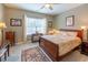 Comfortable bedroom featuring a ceiling fan, neutral paint, a decorative rug, and a window at 1182 Palm Crossing Dr., Little River, SC 29566