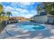 Relax and unwind in the community hot tub with views of the clubhouse and surrounding palm trees at 1182 Palm Crossing Dr., Little River, SC 29566