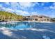 Enjoy a refreshing swim in the community pool surrounded by lounge chairs and well-manicured landscaping at 1182 Palm Crossing Dr., Little River, SC 29566