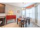 Cozy dining area featuring a table for four, modern lighting, and natural light at 1182 Palm Crossing Dr., Little River, SC 29566