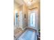 Bright entryway featuring a decorative front door, neutral walls, and modern flooring at 1182 Palm Crossing Dr., Little River, SC 29566