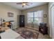 Inviting home office featuring a ceiling fan, natural light, and charming decor at 1182 Palm Crossing Dr., Little River, SC 29566