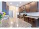 Modern kitchen with dark cabinets, stainless steel appliances, and granite countertops at 1182 Palm Crossing Dr., Little River, SC 29566
