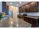 Close-up of a kitchen with stainless steel appliances, and granite countertops at 1182 Palm Crossing Dr., Little River, SC 29566