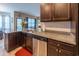 Kitchen with granite countertops, stainless steel appliances, and open access to living area at 1182 Palm Crossing Dr., Little River, SC 29566