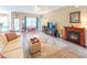 Inviting living room with a fireplace, modern flooring, and open access to the kitchen at 1182 Palm Crossing Dr., Little River, SC 29566