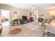 Spacious living room featuring modern flooring, a fireplace, and access to other rooms at 1182 Palm Crossing Dr., Little River, SC 29566