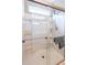 Shower features clear glass doors, seating, showerhead, and shelving at 1182 Palm Crossing Dr., Little River, SC 29566