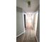 Long hallway with wood-look floors offers access to many rooms at 1221 Tidewater Dr. # 2821, North Myrtle Beach, SC 29582