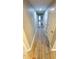 Hallway featuring wood-look flooring and white doors at 1221 Tidewater Dr. # 2821, North Myrtle Beach, SC 29582