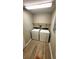 Modern laundry room featuring new washing machine and dryer with wood-look vinyl floors at 1221 Tidewater Dr. # 2821, North Myrtle Beach, SC 29582